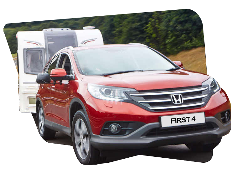 Car towing a caravan.